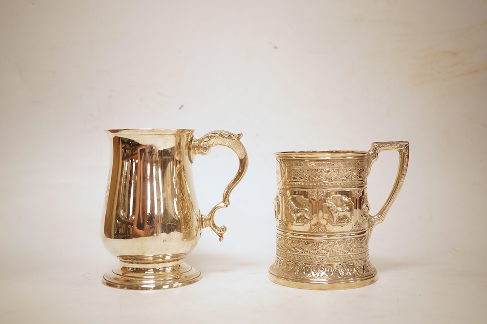 A George III silver baluster mug, Peter & Ann Bateman?, London, 1797, height 10.6cm, together with a late Victorian embossed silver christening mug, Glasgow, 1893, 12.2oz.